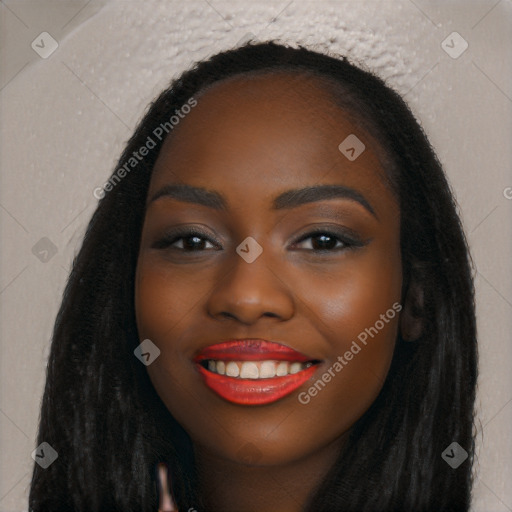 Joyful black young-adult female with long  black hair and brown eyes