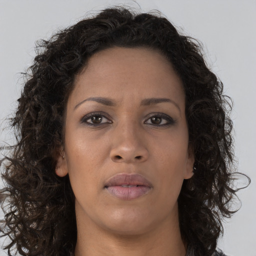 Neutral black young-adult female with long  brown hair and brown eyes