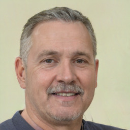 Neutral white middle-aged male with short  gray hair and brown eyes