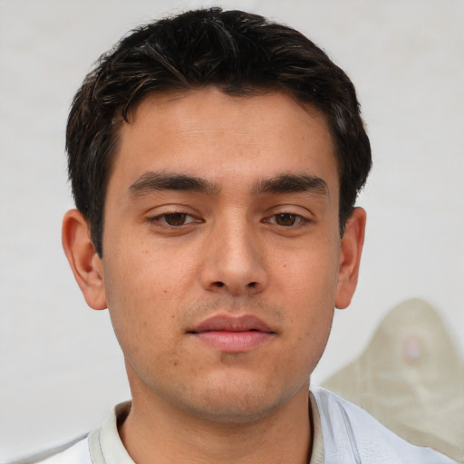 Neutral white young-adult male with short  brown hair and brown eyes