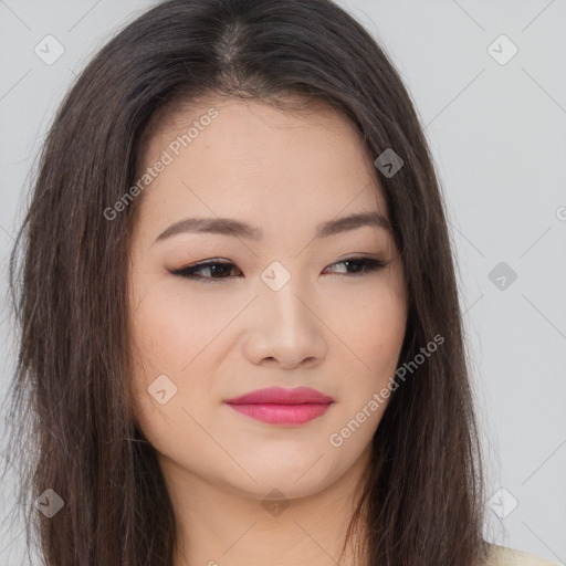 Joyful asian young-adult female with long  brown hair and brown eyes