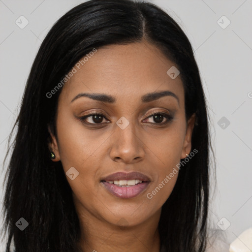 Joyful black young-adult female with long  brown hair and brown eyes