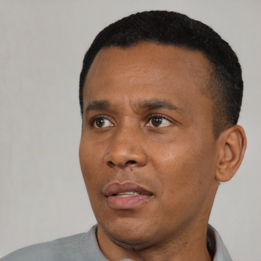 Neutral black young-adult male with short  black hair and brown eyes