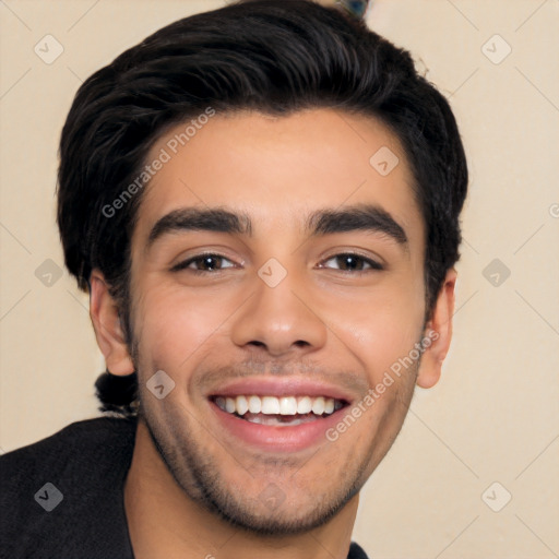 Joyful white young-adult male with short  black hair and brown eyes