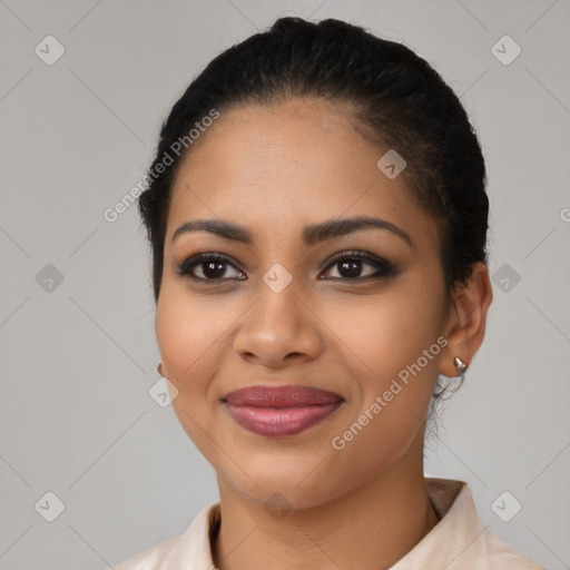 Joyful latino young-adult female with short  black hair and brown eyes