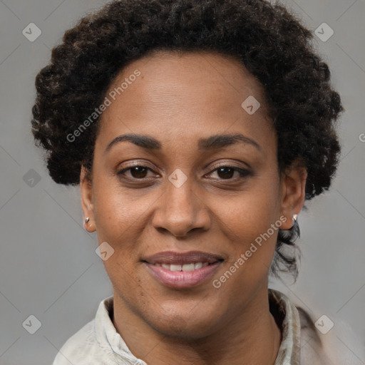 Joyful black adult female with short  brown hair and brown eyes