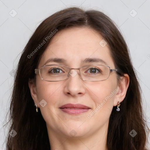 Joyful white adult female with long  brown hair and grey eyes