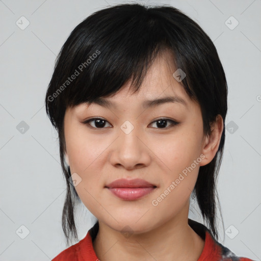 Joyful asian young-adult female with medium  black hair and brown eyes