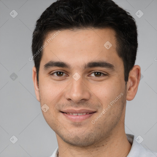 Joyful white young-adult male with short  black hair and brown eyes