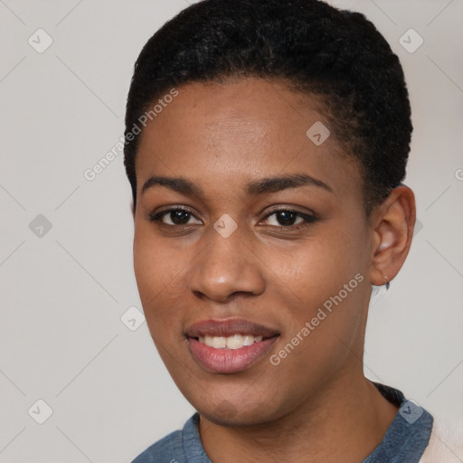 Joyful black young-adult female with short  black hair and brown eyes