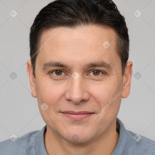 Joyful white adult male with short  brown hair and brown eyes