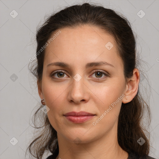 Joyful white young-adult female with long  brown hair and grey eyes