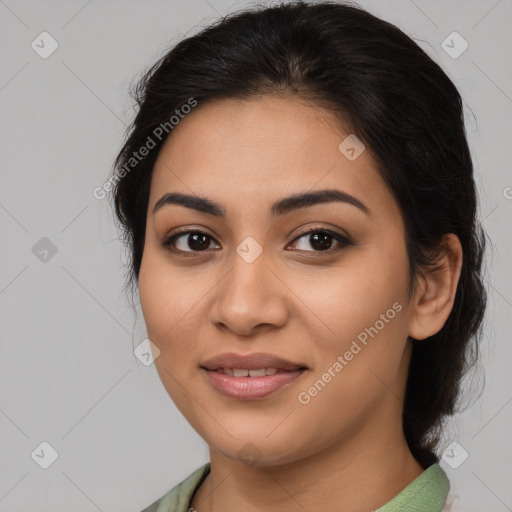 Joyful latino young-adult female with medium  brown hair and brown eyes