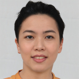 Joyful asian young-adult female with short  black hair and brown eyes