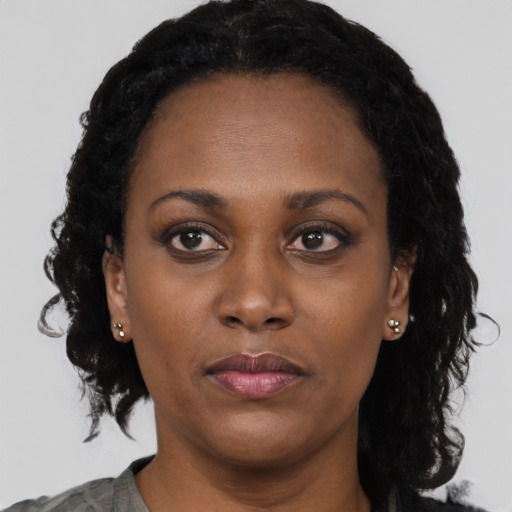 Neutral black adult female with medium  black hair and brown eyes