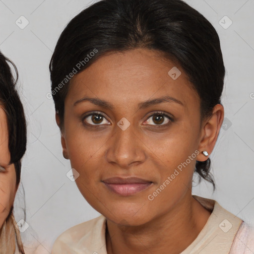 Joyful black young-adult female with medium  brown hair and brown eyes