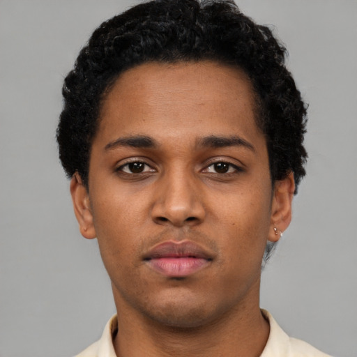 Neutral black young-adult male with short  black hair and brown eyes
