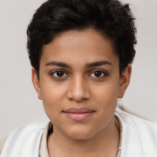 Joyful latino young-adult female with short  brown hair and brown eyes