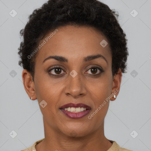 Joyful black young-adult female with short  brown hair and brown eyes