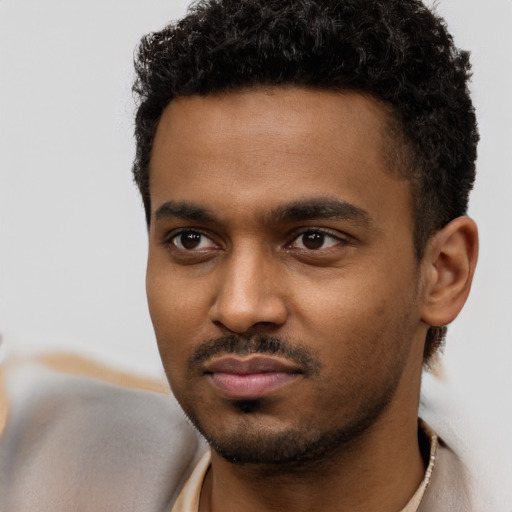 Neutral black young-adult male with short  black hair and brown eyes