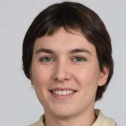 Joyful white young-adult male with medium  brown hair and brown eyes