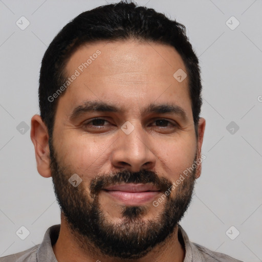 Joyful white young-adult male with short  black hair and brown eyes