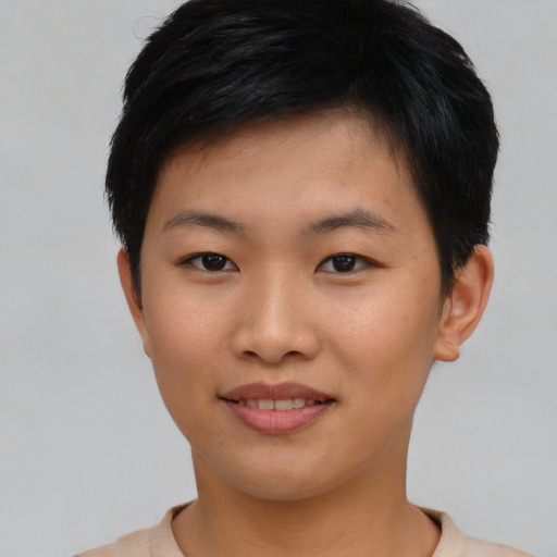 Joyful asian young-adult female with short  black hair and brown eyes