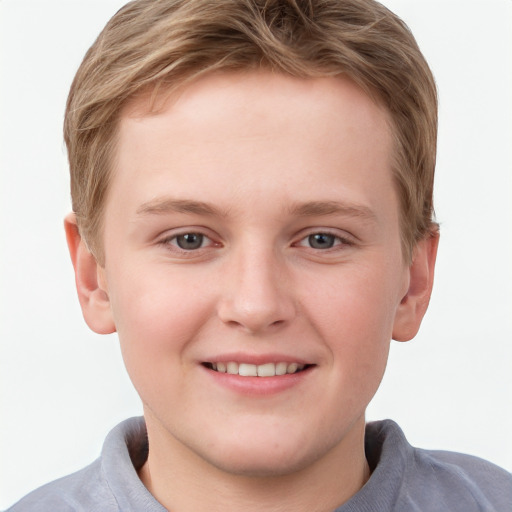 Joyful white child male with short  brown hair and grey eyes