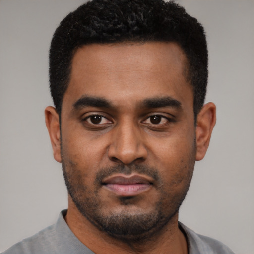 Neutral black young-adult male with short  black hair and brown eyes