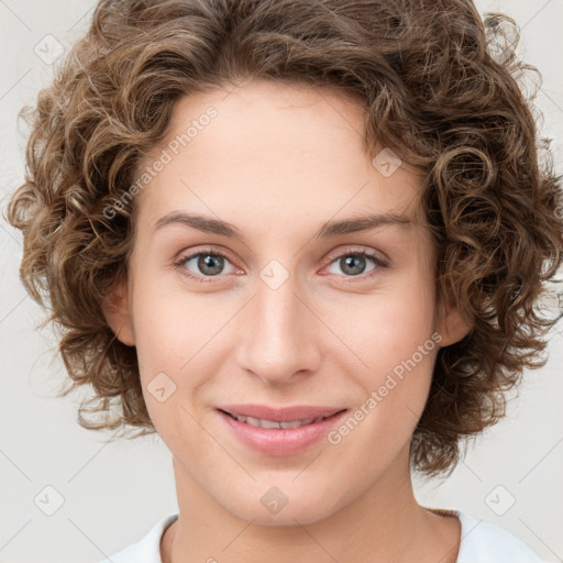 Joyful white young-adult female with medium  brown hair and green eyes