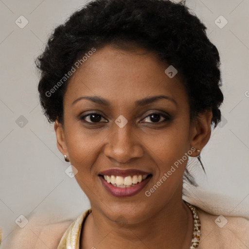 Joyful black young-adult female with short  brown hair and brown eyes