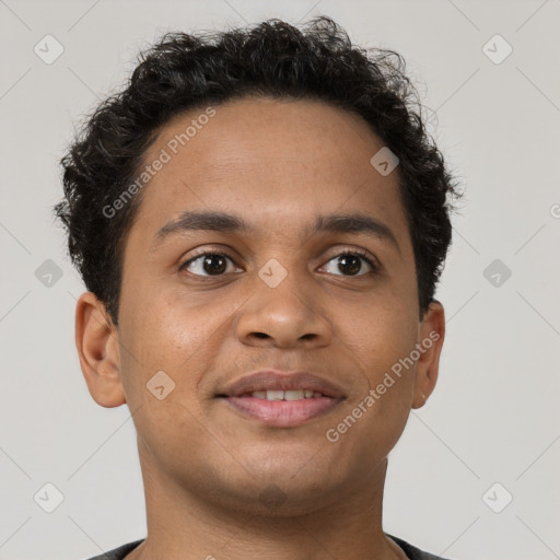 Joyful latino young-adult male with short  brown hair and brown eyes