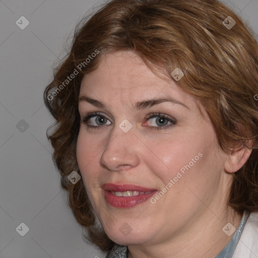 Joyful white adult female with medium  brown hair and blue eyes