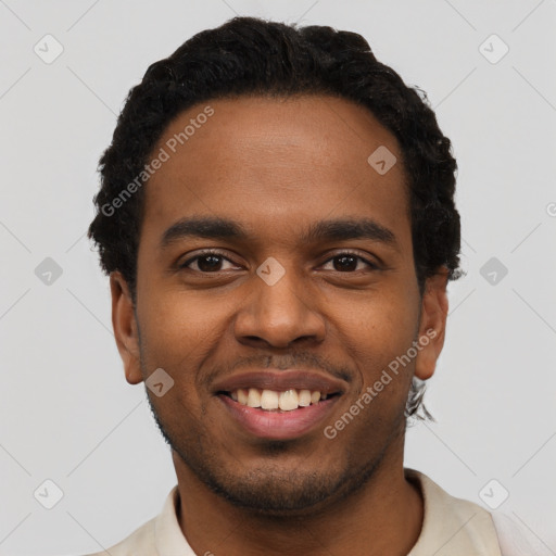 Joyful black young-adult male with short  black hair and brown eyes