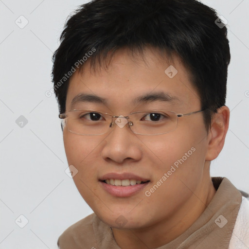 Joyful asian young-adult male with short  brown hair and brown eyes