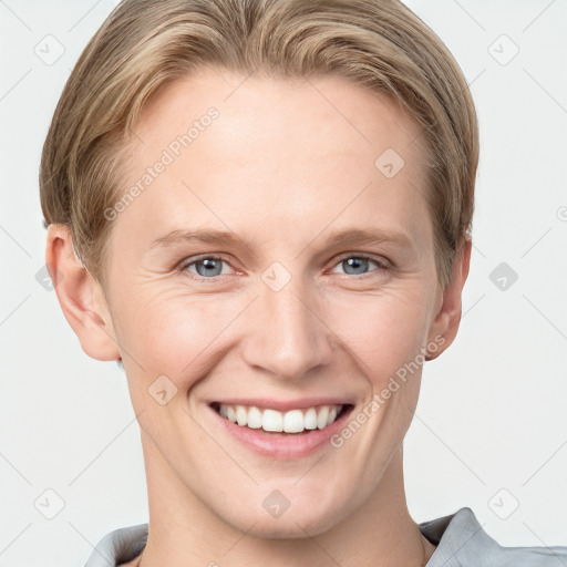 Joyful white young-adult female with short  brown hair and grey eyes