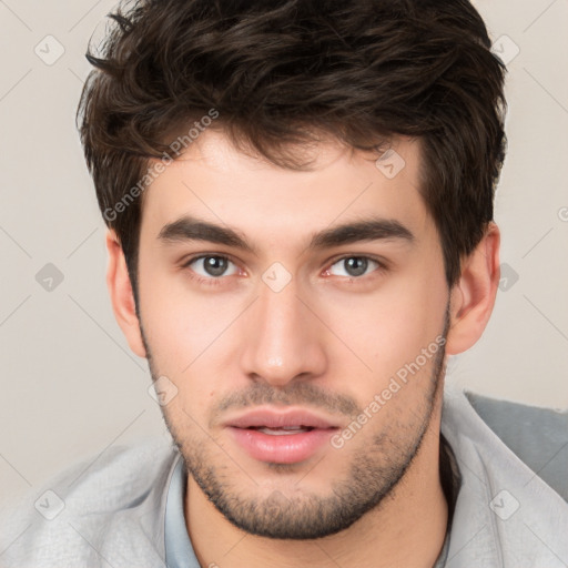 Neutral white young-adult male with short  brown hair and brown eyes