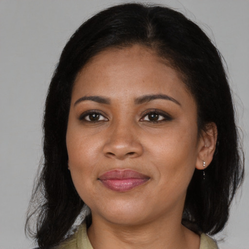Joyful black young-adult female with medium  brown hair and brown eyes