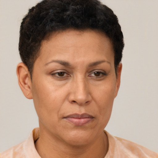 Neutral latino adult female with short  brown hair and brown eyes