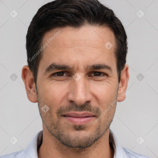 Joyful white adult male with short  brown hair and brown eyes