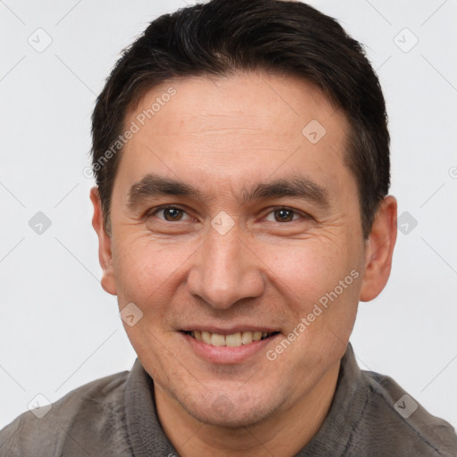 Joyful white adult male with short  brown hair and brown eyes