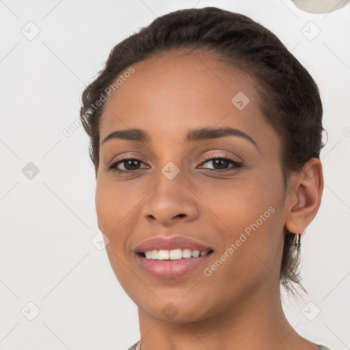 Joyful white young-adult female with long  brown hair and brown eyes