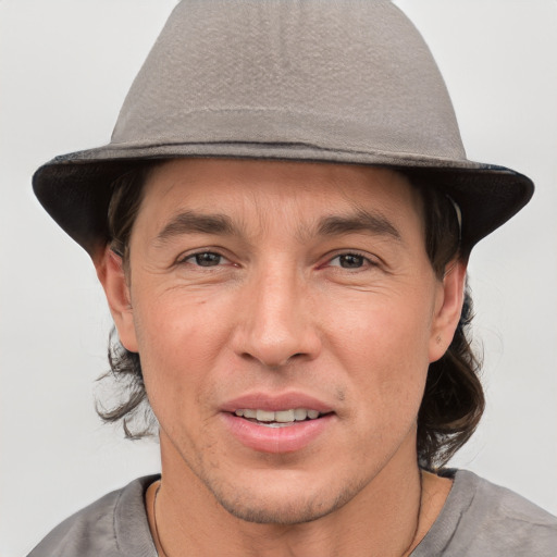 Joyful white adult male with short  brown hair and brown eyes