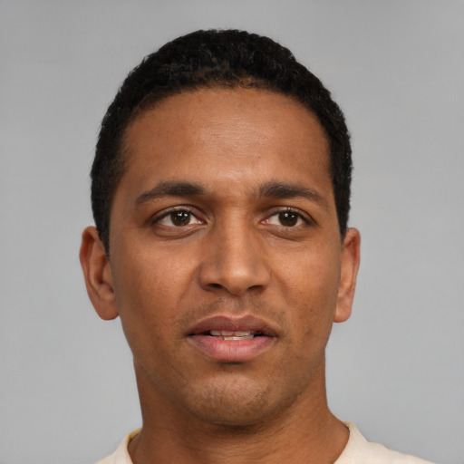 Neutral black young-adult male with short  black hair and brown eyes