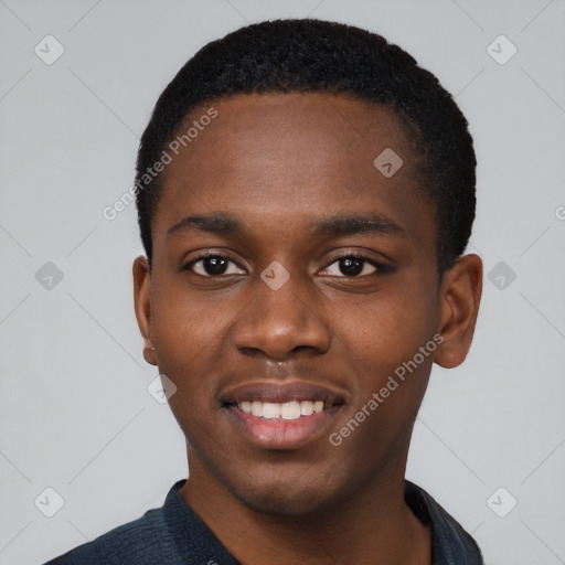 Joyful black young-adult male with short  black hair and brown eyes