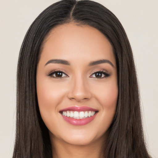 Joyful white young-adult female with long  black hair and brown eyes