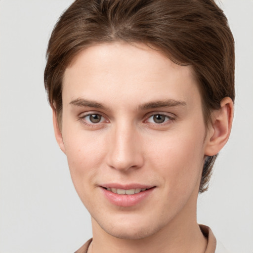 Joyful white young-adult female with short  brown hair and grey eyes