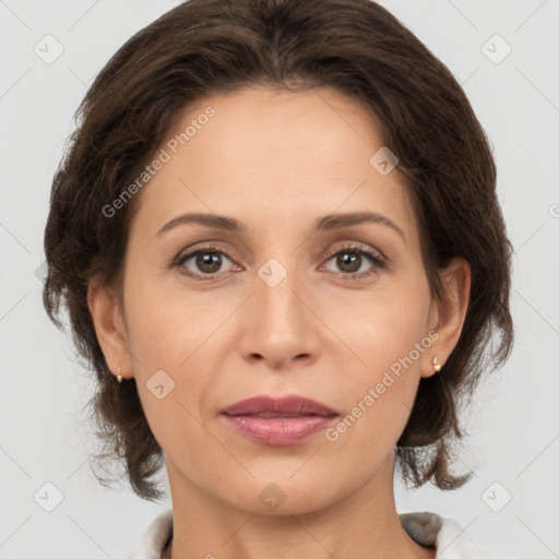 Joyful white adult female with medium  brown hair and brown eyes