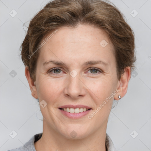 Joyful white adult female with short  brown hair and grey eyes