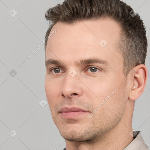 Neutral white young-adult male with short  brown hair and brown eyes